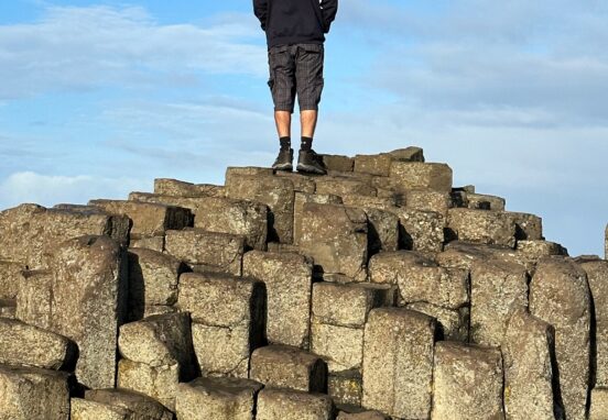 Justin Reynolds standing on Giant's Causeway